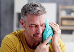 Man using a cold compress