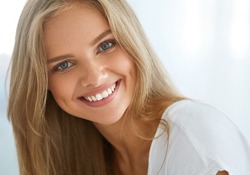 A young woman smiling