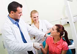 New Lenox emergency dentist shaking hands with a patient