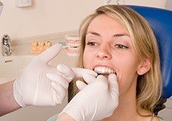 woman being fitted for Invisalign Teen by dentist