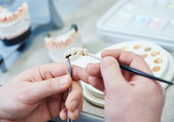 A closeup of artificial teeth for dentures