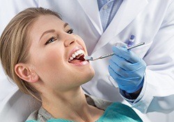 Woman receiving dental exam