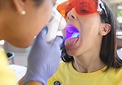 Woman receiving oral cancer screening