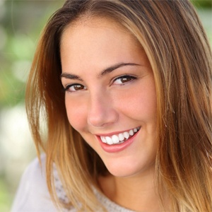 woman smiling outside