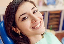 Smiling woman in dental chair