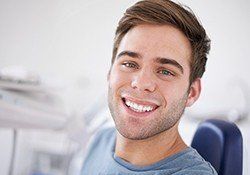 Smiling man in dental chair