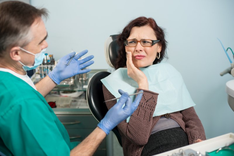 A woman having an emergency dental visit in New Lenox