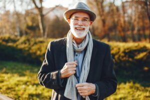 Older man smiling with dental implants 