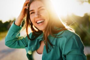 Woman smiling outside during springtime